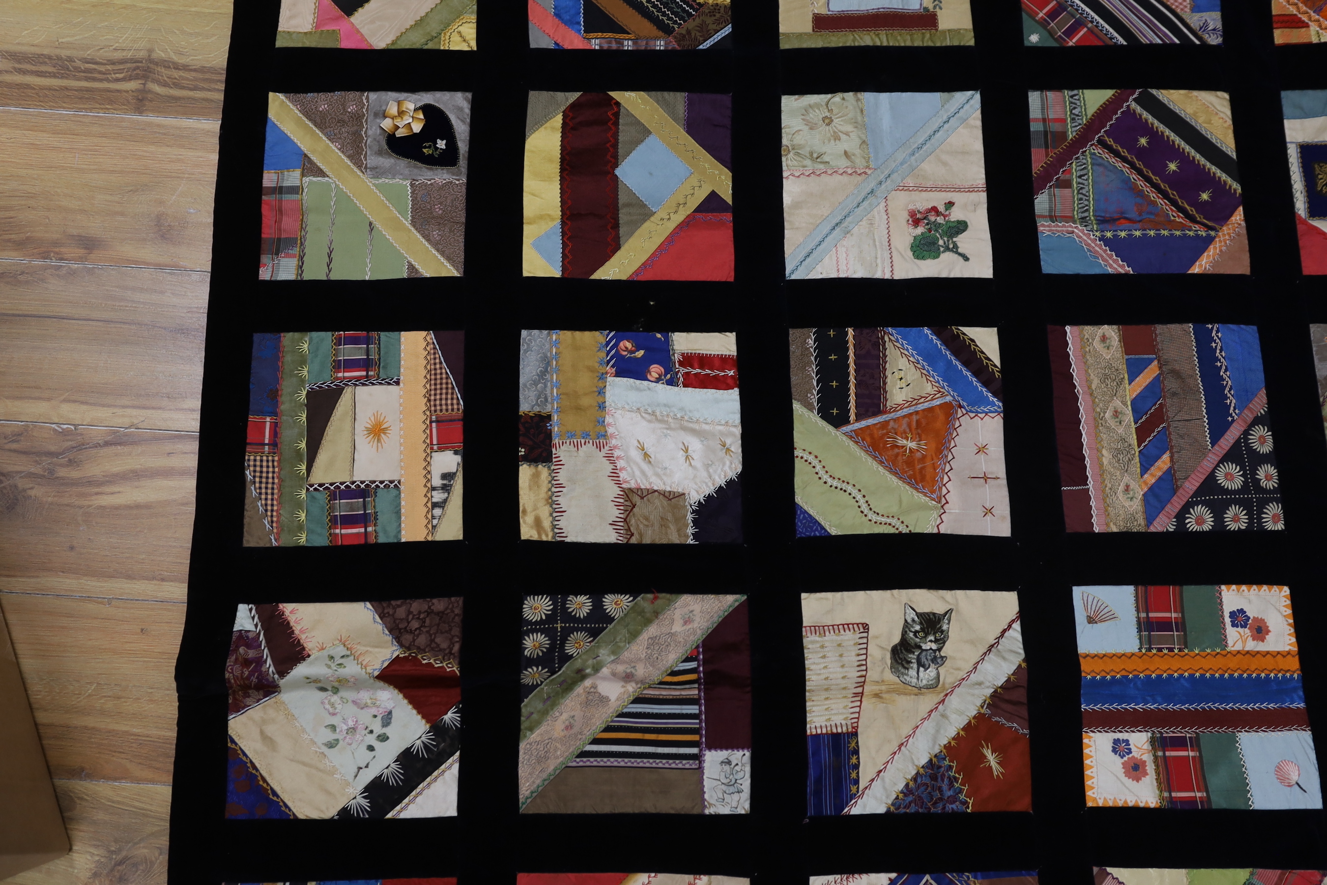 A 19th century crazy patchwork quilt worked with silks and velvets in novelty motifs